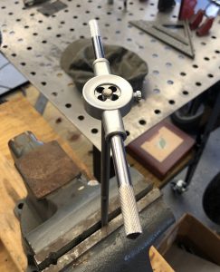 Cutting threads on the stainless steel rod.