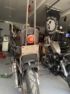 Garage built sissy bar with license plate mount and tail light.