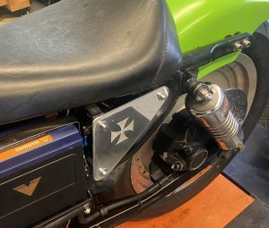 Maltese Cross Etched in the Side Cover Mounted on the Bike